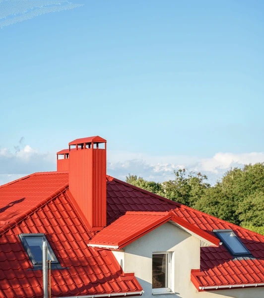 red-metal-roof-tiles-sky-600nw-460382809